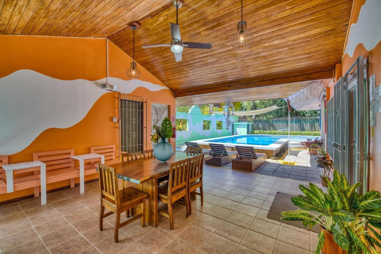 Villas Verdes — covered patio dining beside the pool